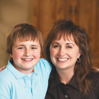 Elizabeth Castor and son smiling